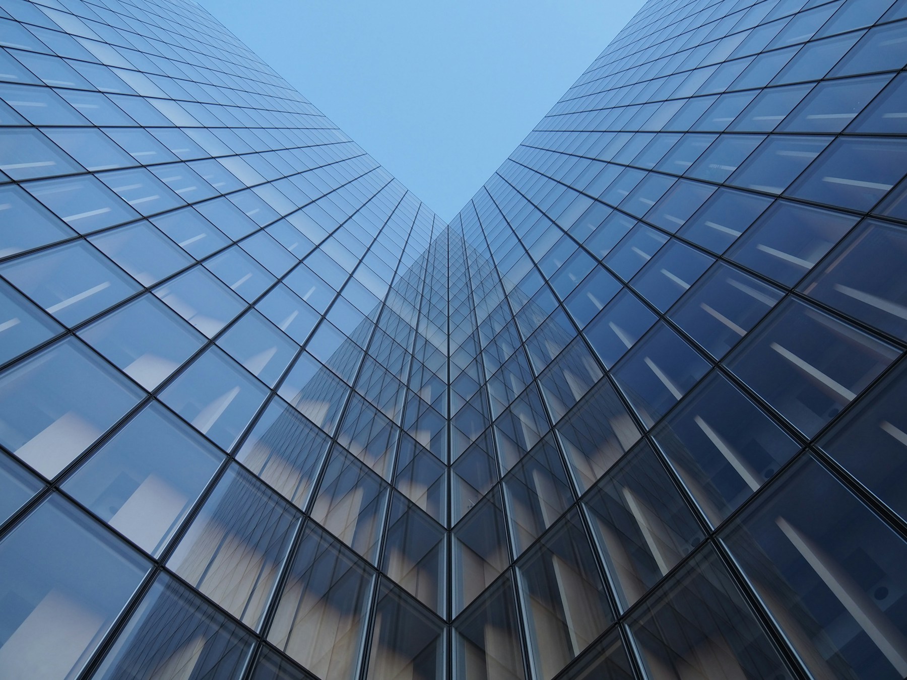 Low-angle view of glass architecture in Paris